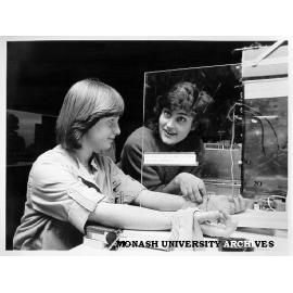 Student Deeta Kimber (right) helping Open Day visitor Vinessa Homer (left) experience sensory illusion