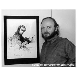 Visiting Canadian poet Jars Balan, with portrait of Ukrainian poet Taras Shevchenko