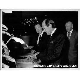 Vice-Chancellor Professor Mal Logan (left) and president of Association of Ukrainians in Victoria signing agreement for teaching and research appointment