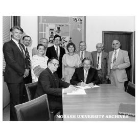 Members of Slavic Languages department and Victorian Ukrainian community at signing of agreement to support lectureship. Mr Stepan Lysenko (seated left) and Vice-Chancellor Professor Ray Martin
