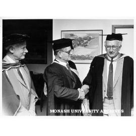 Staff photographer Mr Ben Baxter (centre) after award of honorary Master of Science with director of Sports and Recreation Mr Doug Ellis (right) and Professor Ron Brown