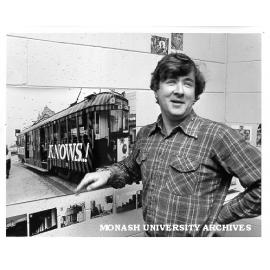 Lecturer Dr Conrad Hamann explaining the 'Mother Knows ...!' Melbourne tram