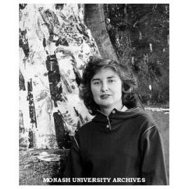 Professor Margaret Plant in front of the John Walker painting in her office