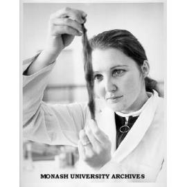 Miss Joan de Bollo with sample of dye treated wool