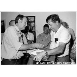 Senior lecturer Ian Hiscock receiving retirement gift from Ian Bayly