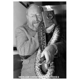 Recipients of 25 year medalliion, laboratory manager Mr Jim Guthrie and python Horace