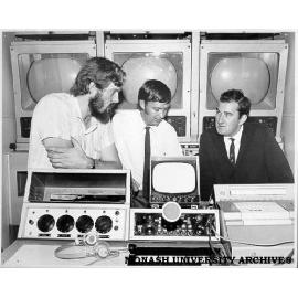 Control cabin of the mobile television unit. Camera control operator Richard Crompton (left), with maintenance technicians Peter Boyle and Don Black
