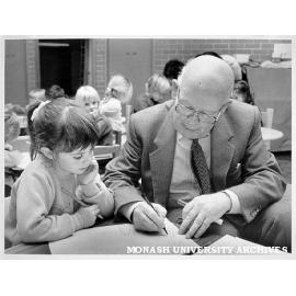 Tom Gourdie demonstrating new writing style at Krongold Centre for Exceptional Children