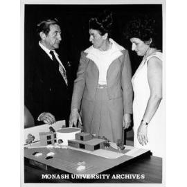 Dinah and Henry Krongold with Professor Marie Neale (centre) and model of proposed Krongold Centre