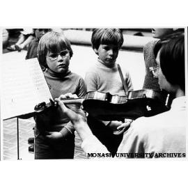 Krongold Centre children taking part in enrichment program with members of National Music Camp Students Association