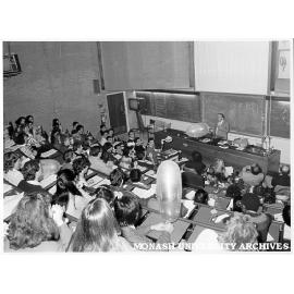 Professor Roger Short discussing condoms with medical students