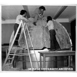 Student Walter Giadini working on mini planetarium with help from technical staff Ron Harrison and Paul Davies