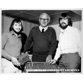 Deputy Warden of Union Doug Ellis inspecting voting console designed by students in computer science, including postgraduate John Rosenberg (left) and tutor Peter Dewildt