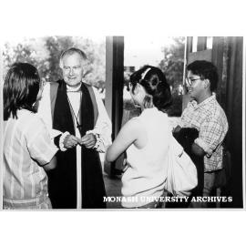 Bishop Peter Hollingworth talking with students Wendy Tap (left) and Renee Tan (second right) after service in the Religious Centre to mark beginning of the academic year