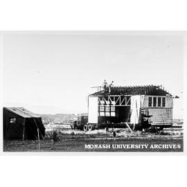 Moving old school house, February 1964