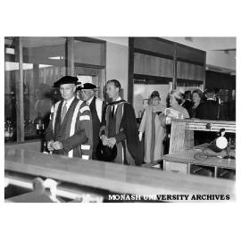 Interim Council Chairman Robert Blackwood, Mr Justice Lowe, Professor Ron Brown and guests touring Science buildings following university's opening ceremony, March 1961