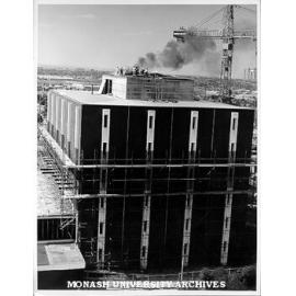 Fire in roof of Main Library during construction, March 1975