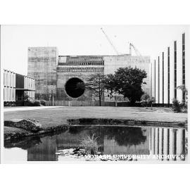 Great Hall under construction, view of west facade flanked by University Offices and Main Library