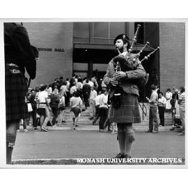 Graham McGregor (facing) and Keith Wilkins (left) piping students into Robert Blackwood Hall