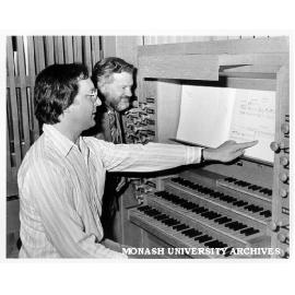 John O'Donnell (left) checking score of 'Orgelwerk' with Graduates Association president, David Harris