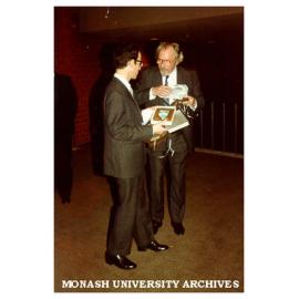 Organist Dr Harold Fabrikant (left) and conductor Mr William Reid at reception following Silver Jubilee Commemorative Concert