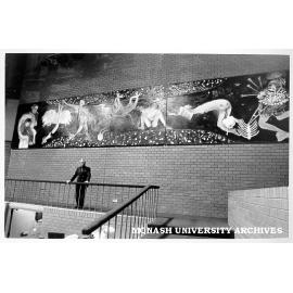 Robert Blackwood Hall Director, Mr Harold Karpin in front of Arthur Boyd triptych 'Australian Scapegoat'