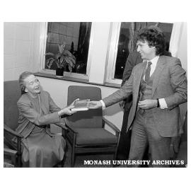 Professor Max King presenting book in honour of Professor Don Cochrane to Mrs Margaret Schofield