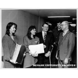 Representatives of J. B. Were and Sons at hand over of records to Donald Cochrane library. Librarian Henry Thorburn at right