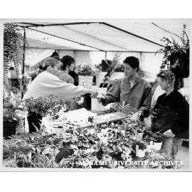 Customers at plant stall, Friday market
