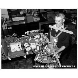 Tim McNair with goods to be sold in 'garage sale' of used equipment