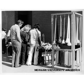 Browsers at candle stall, Friday market