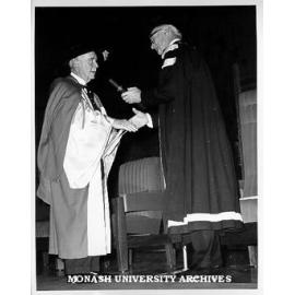 Sir Edmund Herring (left) receiving honorary Doctor of Laws from Vice-Chancellor Dr Louis Matheson