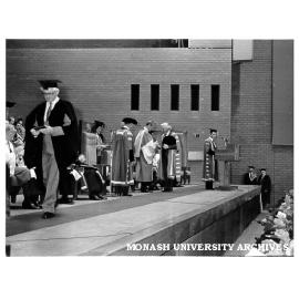 25 year medal presentation. Imports Officer Mr Norm Watt leaving stage; Professor Kevin Westfold receiving medal from HRH Prince Philip, Duke of Edinburgh