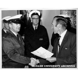 Deputy Comptroller Ian Tate presenting Safety Council certificate to driver Rodney Dickson