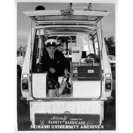 Ron Berry of Central Services inspecting equipment in emergency vehicle