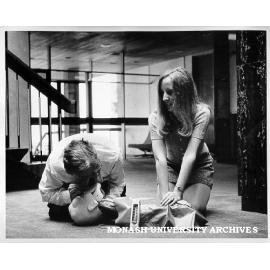 Julie Brown applying heart massage, while Safety Officer Bill Barker performs resuscitation