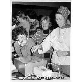 Visitor to Physiology department trying 'rotary pursuit' machine