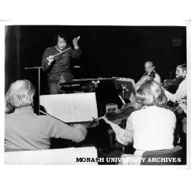 Japanese conductor Hiroyuki Iwaki with members of Melbourne Symphony Orchestra