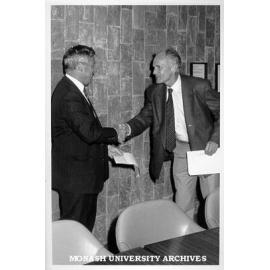 Dean Professor Robert Porter (left) presenting Dr Uwe Proske with Medicine Faculty Award