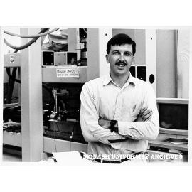 Student Mr Julian Seidel in front of Cyclic Constant Normal Stiffness Direct Shear Machine