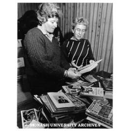 Mrs Margaret Krishnapillai (left) and Mrs Brenda Holloway sorting books for Book Fair