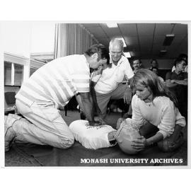 Louise Tyson and John van der Hilst practicing cardio pulmonary resuscitation