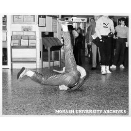 Lino Ettia of Backstreet Boogy break dancing in Union foyer, Open Day
