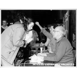 Records officer George Bloom re-enrolling students