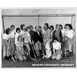Coach Florence Vasey (centre) and Women's hockey team