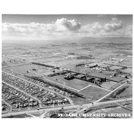 Aerial view of Clayton campus, September 1960, intersection of Wellington and Dandenong roads in foreground
