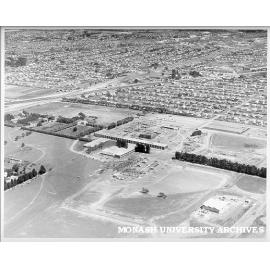 Aerial view of Science buildings under construction, March 1961, from east with Clayton in background
