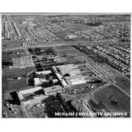 Aerial view of building construction, July 1962, from north, with intersection of Wellington and Dandenong roads in background