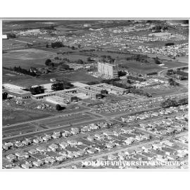 Aerial view of building construction, July 1962, from north west looking over houses of Beddoe and Marshall avenues