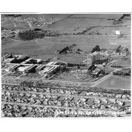 Aerial view of building construction, July 1962, from west with Beddoe and Marshall avenues in foreground and halls in back left hand corner